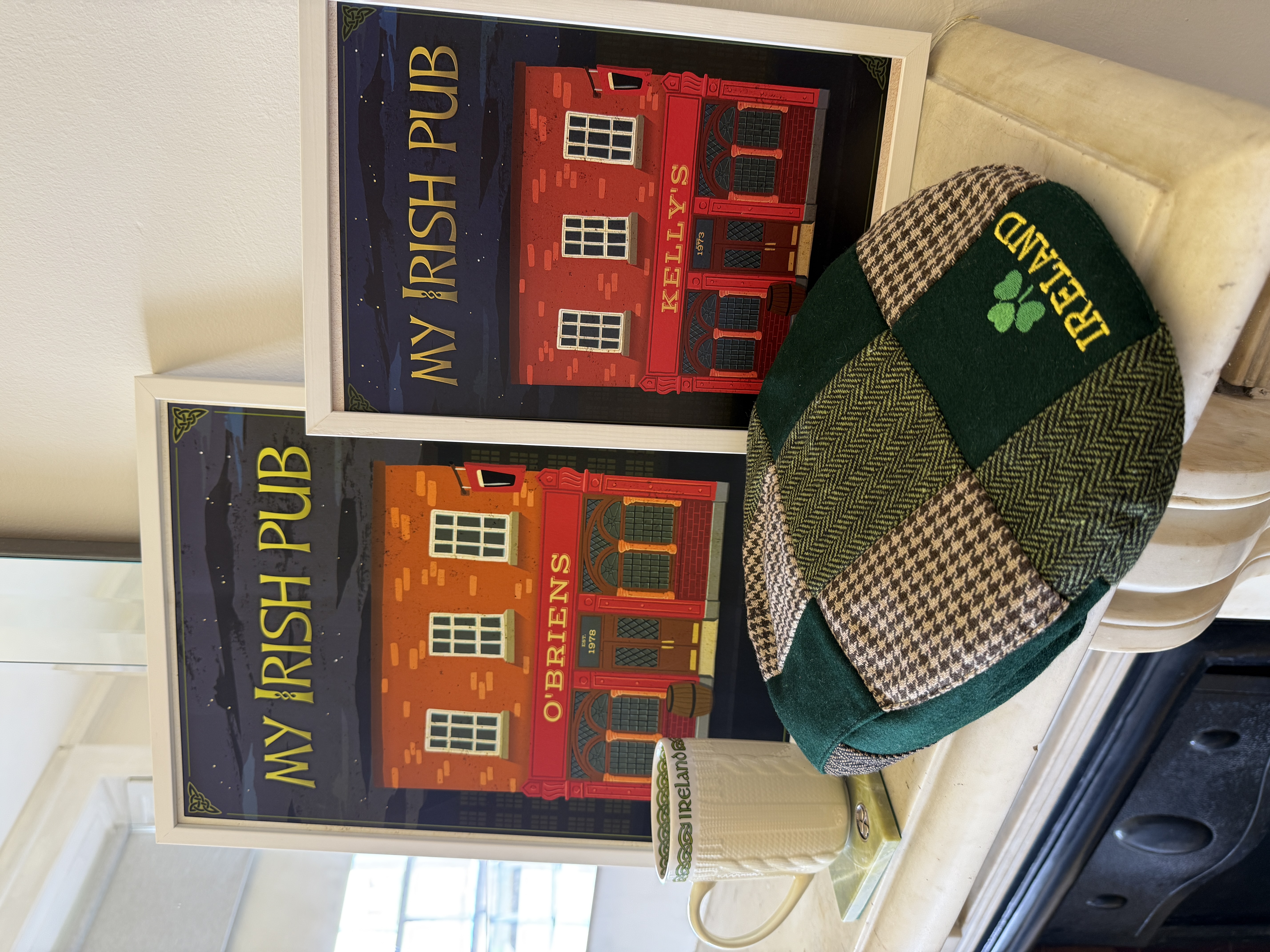 O'Briens and Kelly's framed prints on mantelpiece