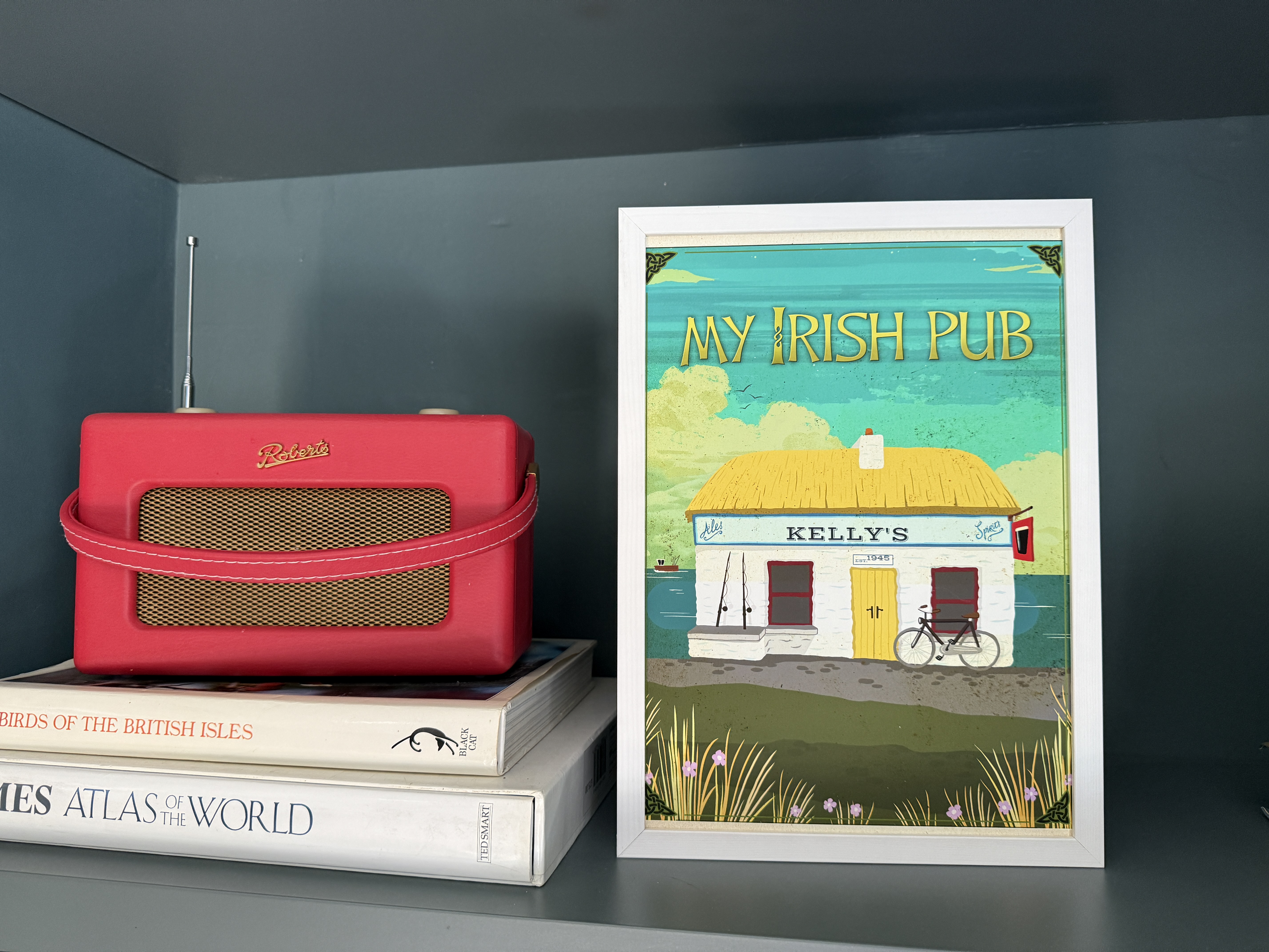 Kelly's seaside print on bookshelf